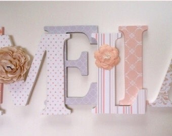 Wooden letters for nursery in peach , tan, gray and white.