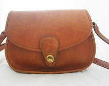 Popular items for coach leather bag on Etsy