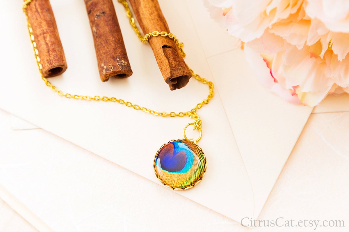 https://www.etsy.com/listing/109998124/golden-peacock-feather-necklace
