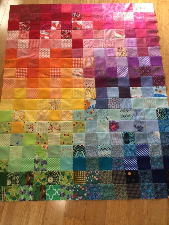 Lap-sized patchwork quilt in rainbow colors by HandmadebyAnnaZ