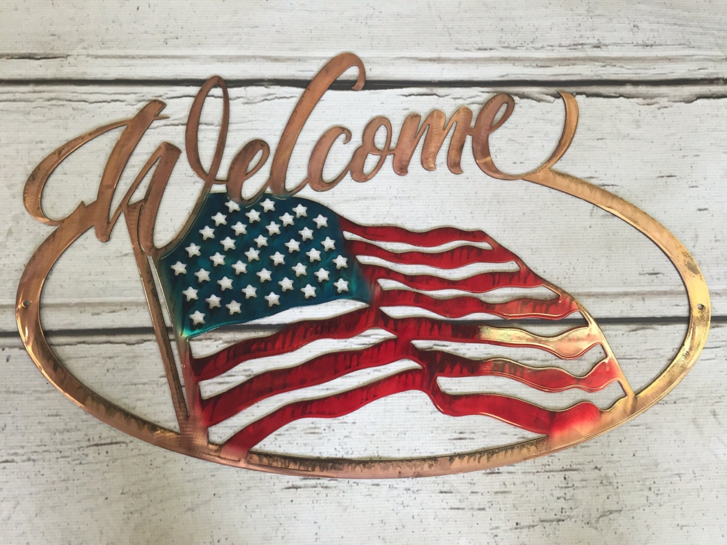 Welcome sign with American Flag