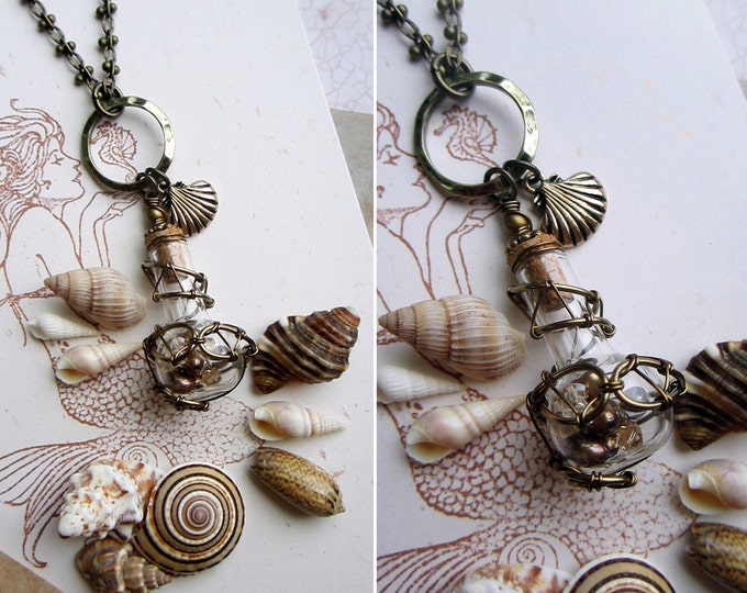Enchanted necklace "Mermaid Soul" with wire wrapped glass vial filled with golden pearls and Swarovski crystals.