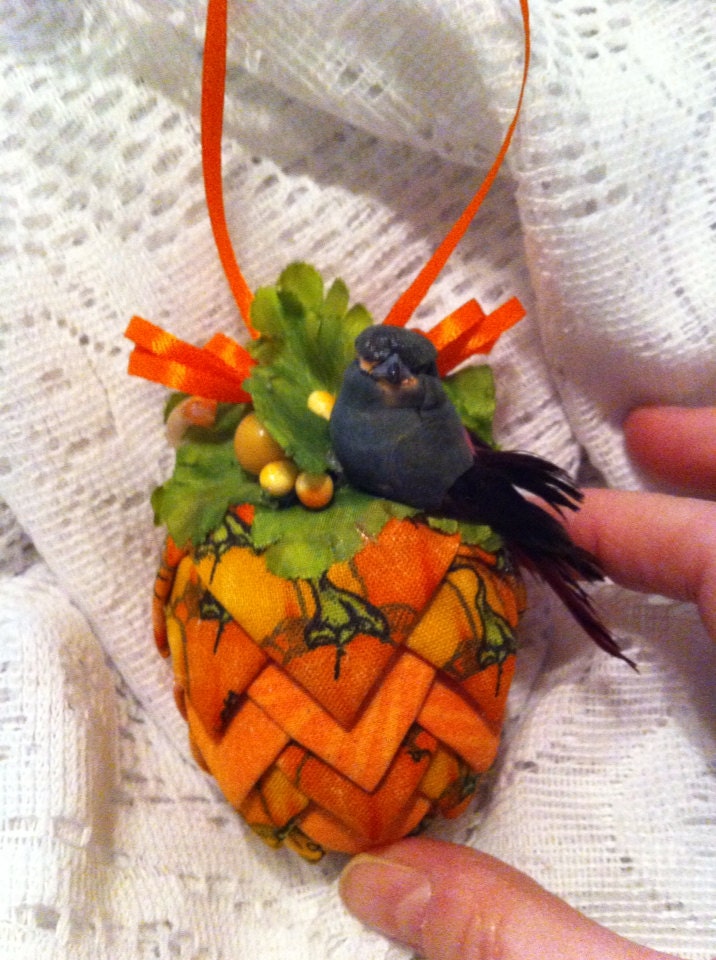 Orange fabrics pinecone decoration.