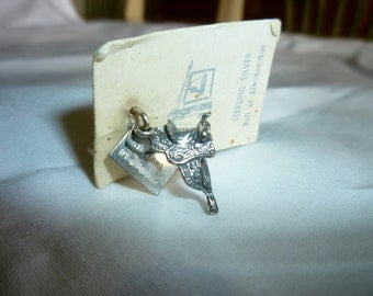 Sterling Silver Charm Horse Saddle, 3 dimensional saddle. New, On original card, Bell of Albuquerque store logo. Denver CO, 1978