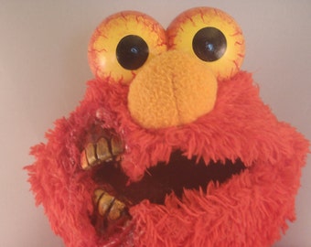 dead elmo doll