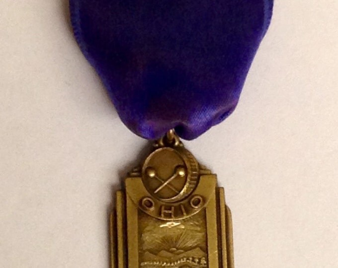 Storewide 25% Off SALE Vintage Bronze Tone Ohio's Music Educational Association Band Award Pin Featuring Purple Silk Style Banner Storewide 25% Off SALE Vintage Bronze Tone Ohio's Music Educational Association Band Award Pin Featuring Purple Silk Style Banner