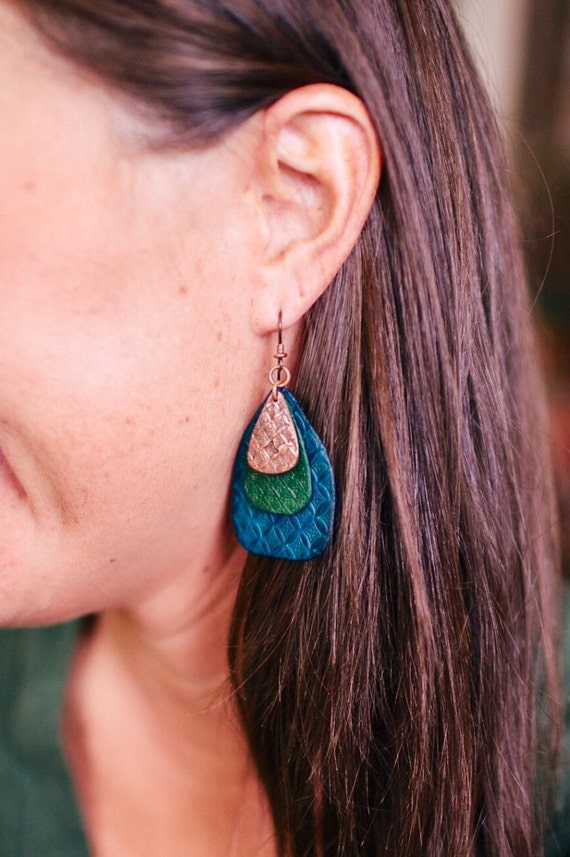 Leather and Copper earrings. Hand tooled leather with stamped