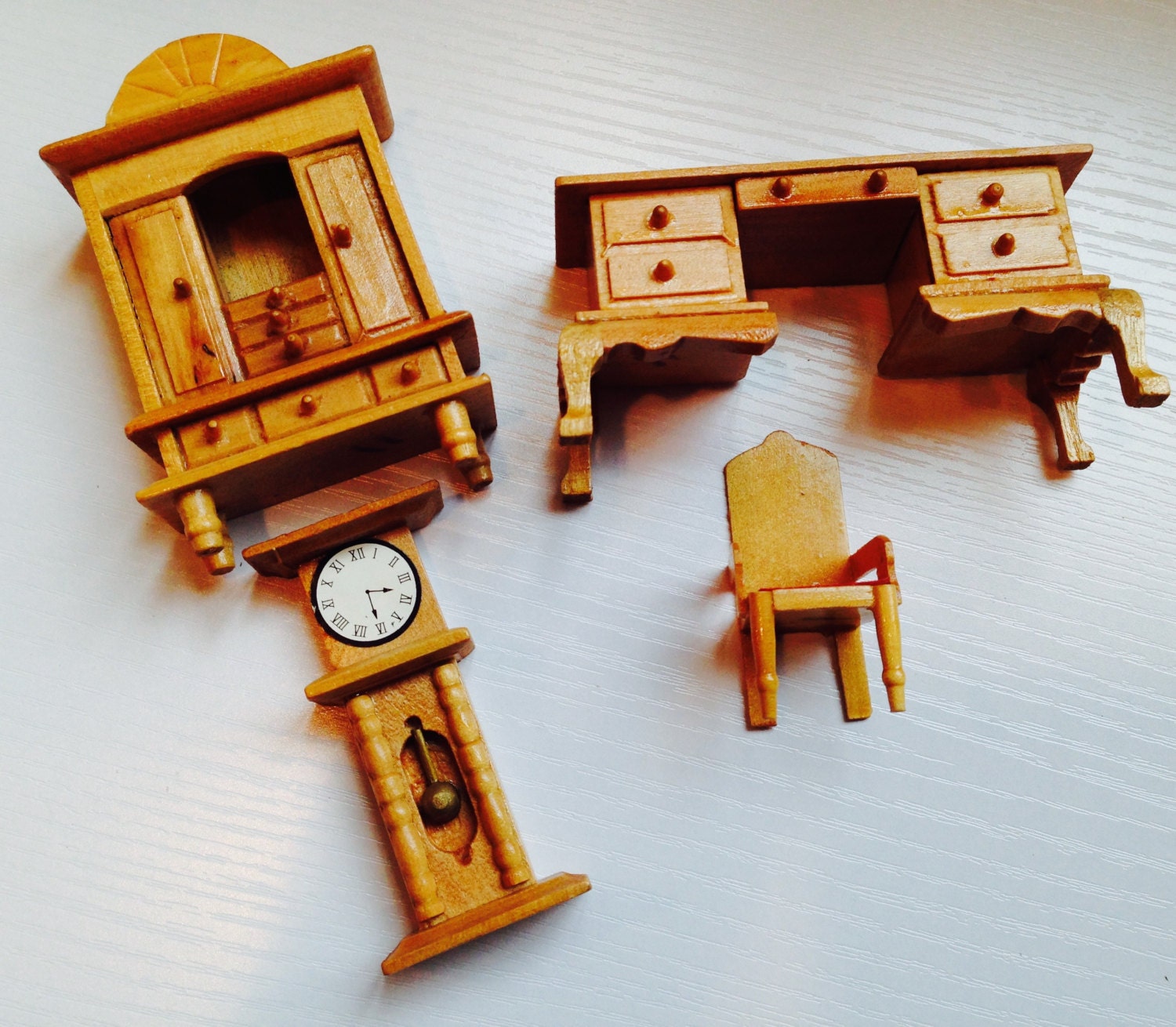 wooden dollhouse and furniture