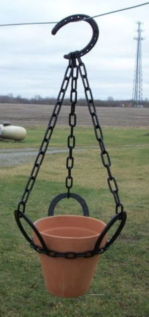 Horseshoe hanging basket holder