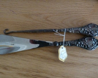 silver shoe horn and hook