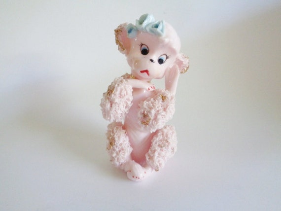 pink spaghetti poodle figurine