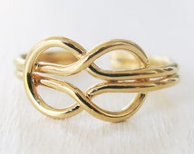 Popular items for infinity knot ring on Etsy