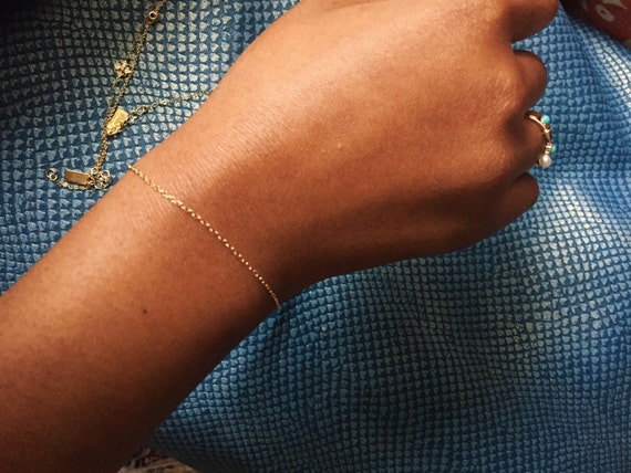 https://www.etsy.com/listing/279188784/14kt-gold-bracelet-solid-gold-bracelet?ga_order=most_relevant&ga_search_type=all&ga_view_type=gallery&ga_search_query=solid%20gold%20delicate%20bracelet&ref=sr_gallery_8