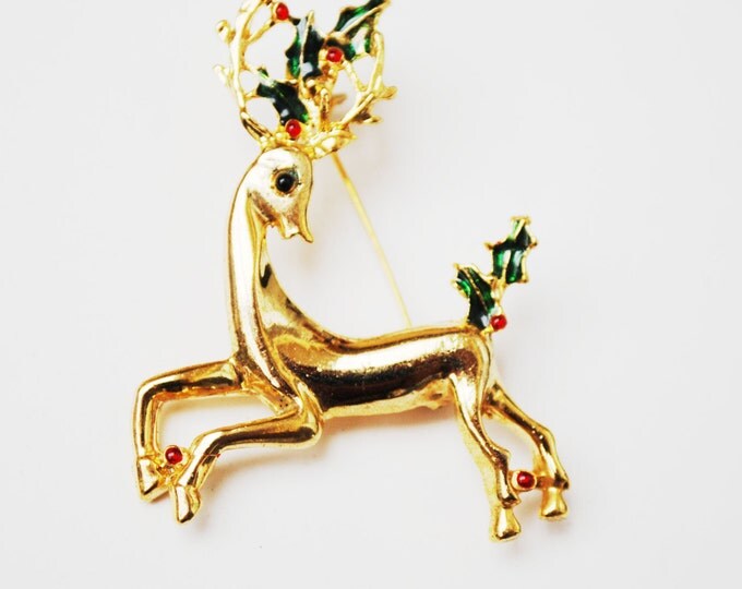 Vintage Christmas Reindeer Brooch Gold tone with red rhinestones and green enamel Holly Holiday Pin