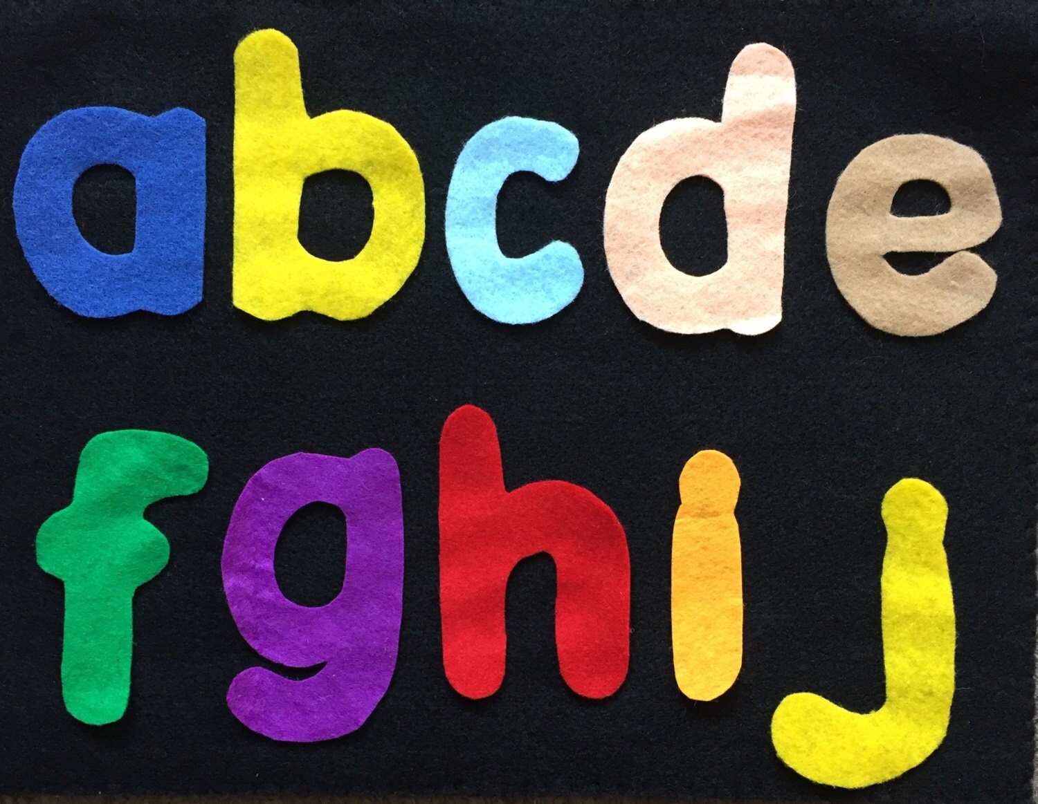 Felt alphabet shapes with a black felt board