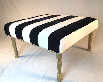 Sold-can replicate custom ottoman black and white stripes with gold accents