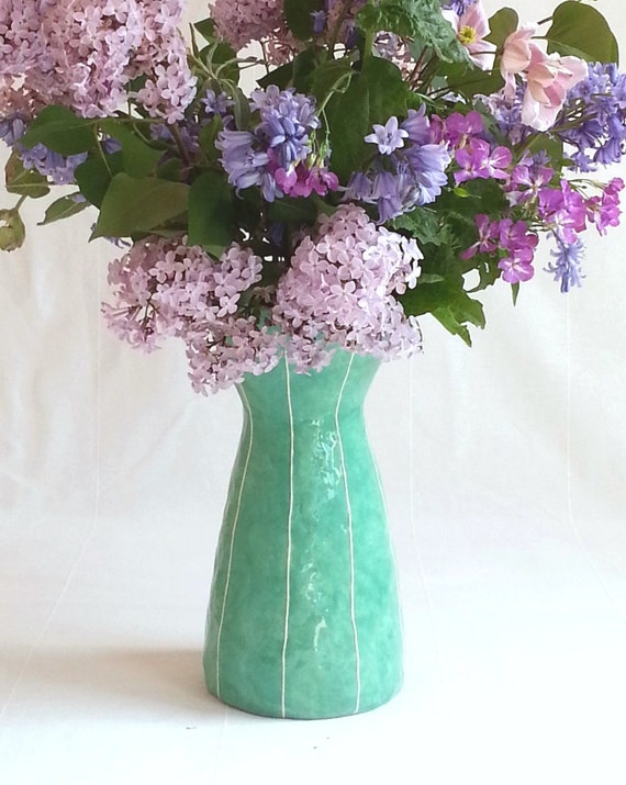 Ceramic vase for long stem flowers. Tall shape with white