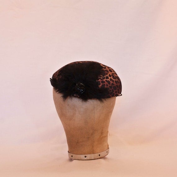 Handmade leopard print ladies hat decorated with black feathers and beading