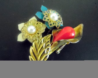 Vintage gold-tone brooch with what appear to be enameled flowers with pearl centers. vintage brooch, vintage jewelry