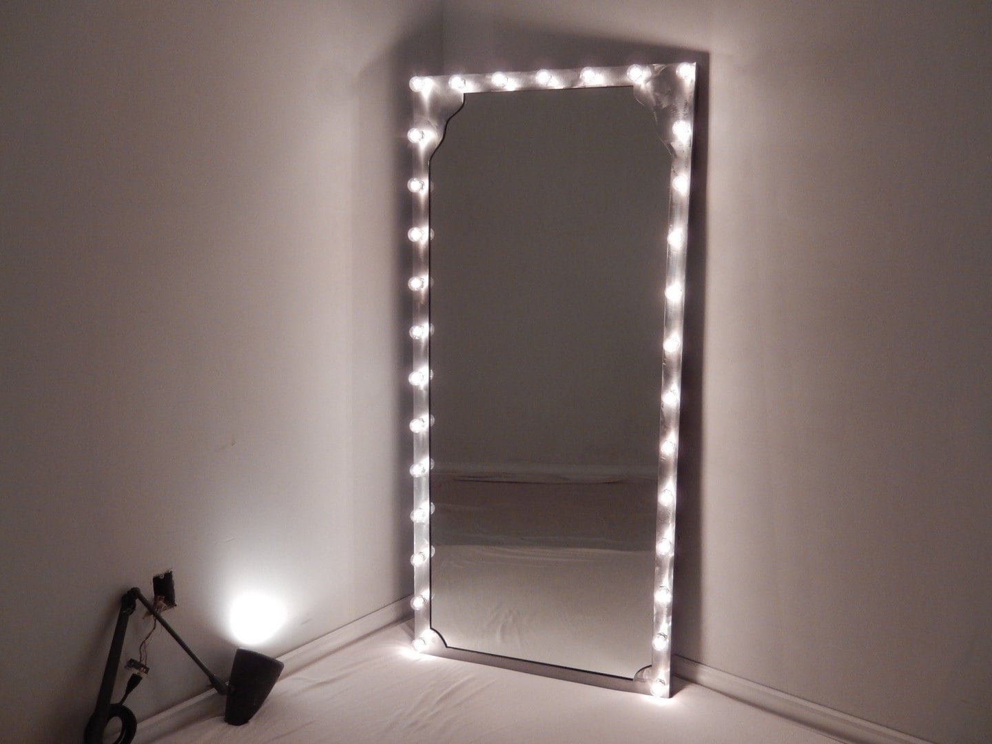 Steel framed mirrors with vanity lighting as options