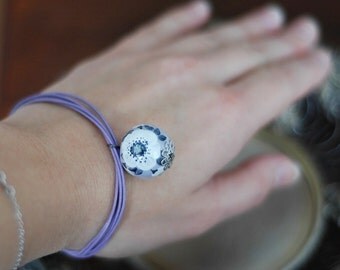 Charm bracelet with hand painted ceramic bead