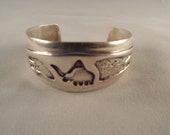 Navajo Cuff Bracelet fine Stamp work with unusual Forms and designs.  Very Large. 62.7 grams.  Vintage Jewelry, Ethnic Jewelry Dinasuor