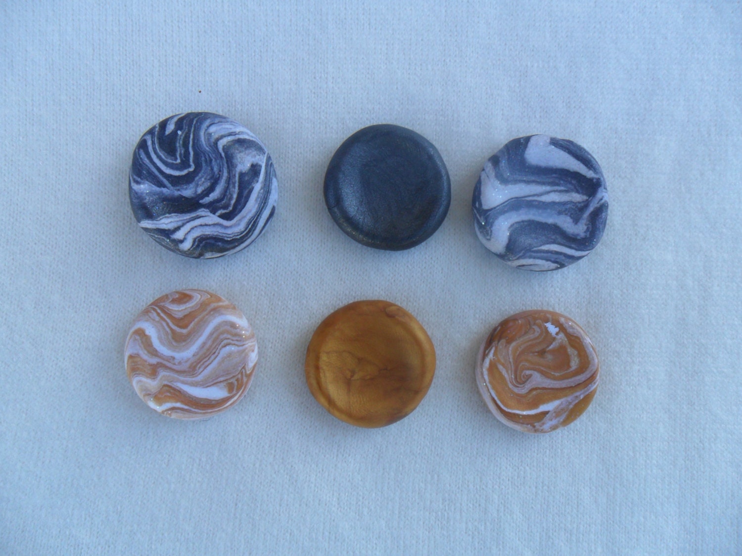 Worry stones are hand made in the USA with polymer clay by Trifx