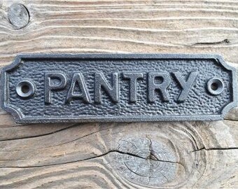 A lovely vintage style cast iron pantry door sign