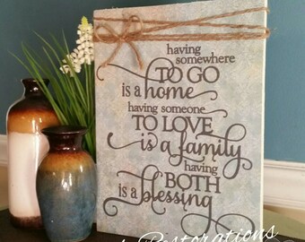 Wooden sign with scripture, Having somewhere to go is home, having someone to love is a family, having both is a blessing, religious sign