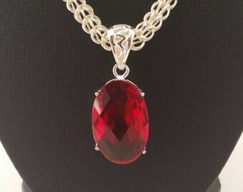 Ruby red pendant on a full persian weave silver plated chain maille necklace