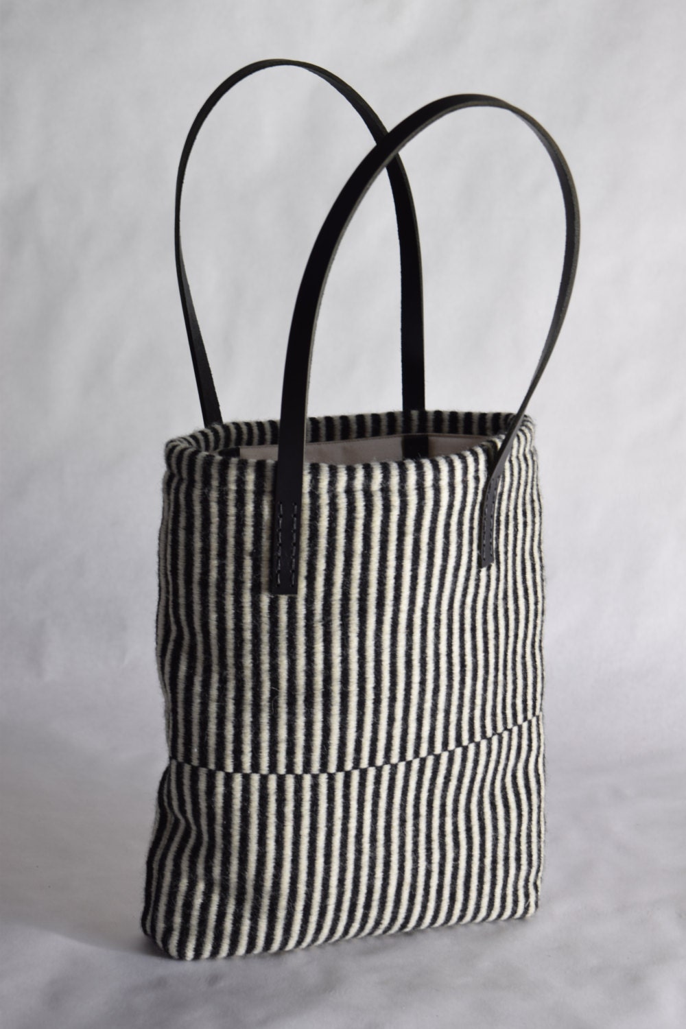 Hand woven black and white striped tote bag black leather wool