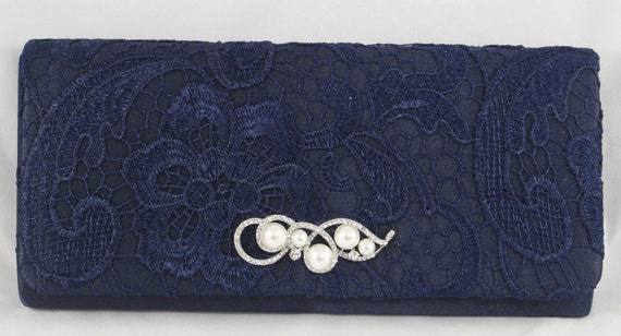 navy blue and white clutch bag