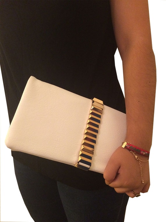 white clutch with gold