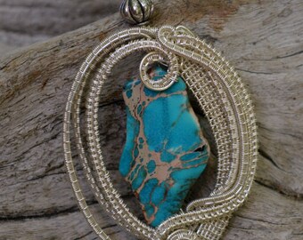 A handmade wire wrapped necklace, silver wire woven around polished stone, wire wrapped jewelry a great gift, pendant has a ball chain