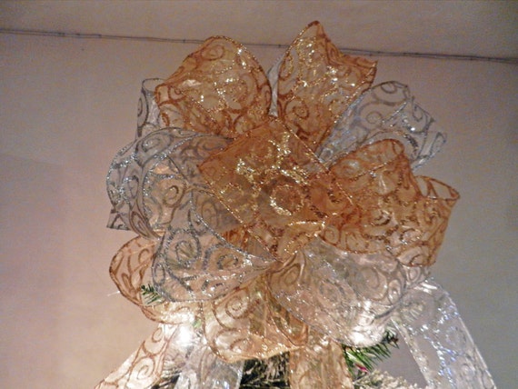 large christmas tree topper bow made with a sheer gold ribbon large christmas tree topper bow made with a sheer gold ribbon