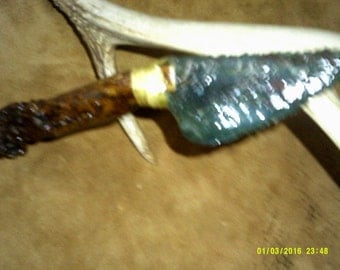 Coral knife blade, green/splotches of tan, deer antler handle