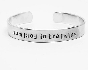 Demigod in Training: Hand Stamped Aluminum Percy Jackson Cuff bracelet by fandomonium
