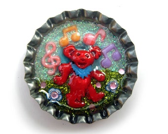 Grateful Dead pin, dancing bear hat pin, let there be songs, handmade and one of a kind, enamelled bear in bottlecap with music and flowers