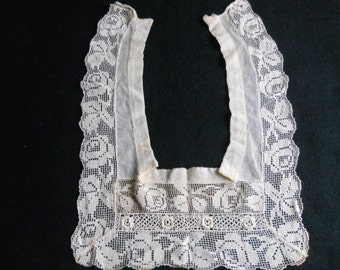 Antique lace inset, square. Attaches behind neck.