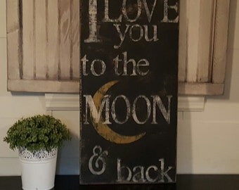 Distressed and vintage look I love you to the moon and back sign/wall decor