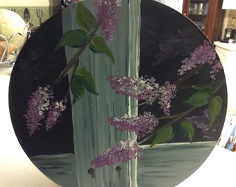 Round wooden box with lilacs painted on top