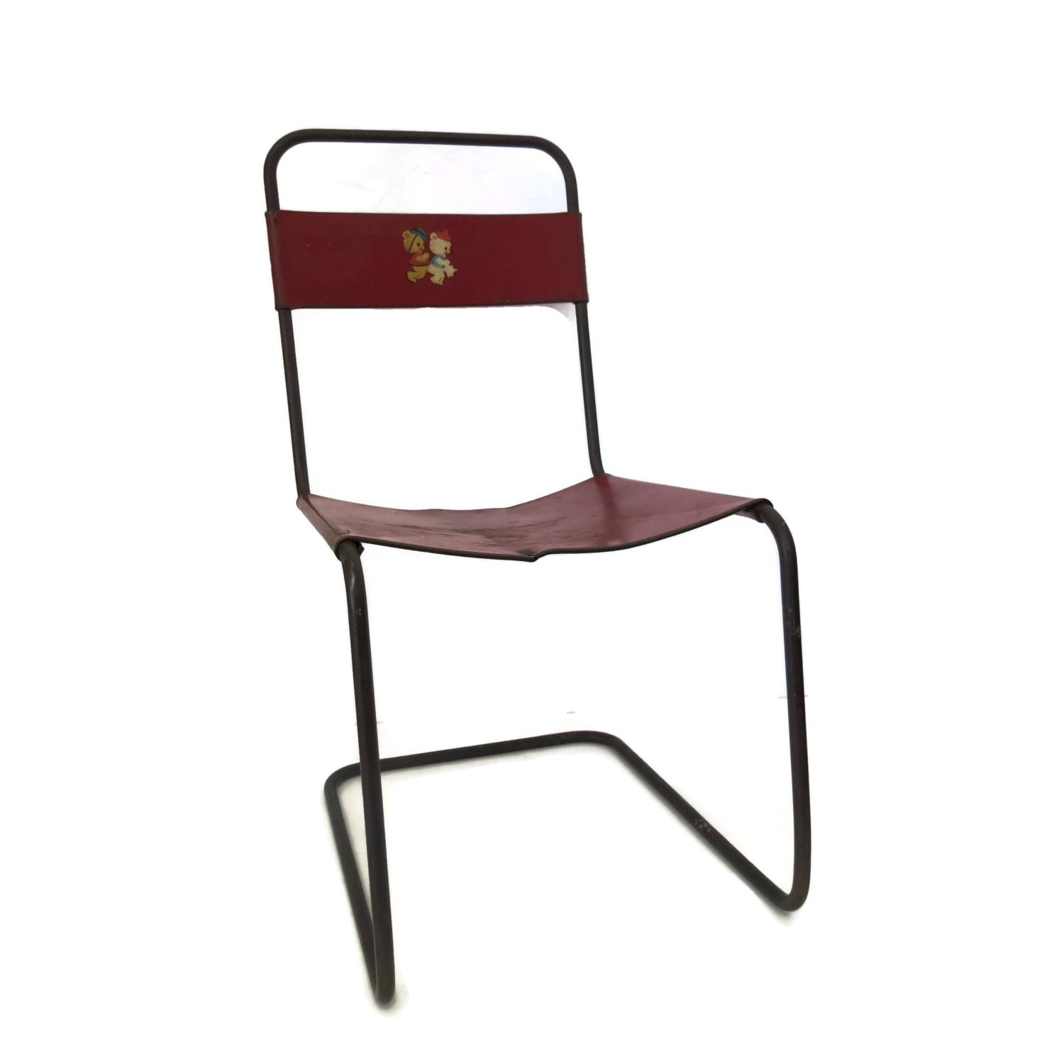 Vintage red metal childs chair circa 1950's photography