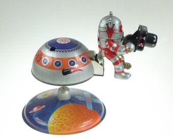 Astronaut with Space Station and Camera Clockwork Old Tin Toy