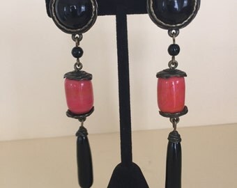 Andrew GN clip on coral and black onyx earrings.