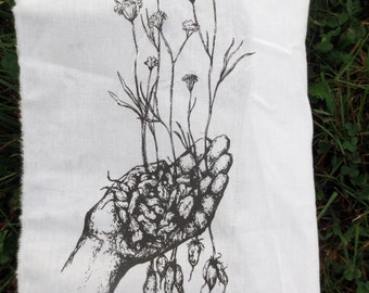 little roots back patch -- wild yampah roots and flowers held in our hands silkscreened orgininal drawing by amara hollow bones