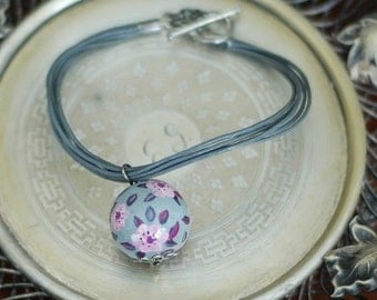 Charm bracelet with hand painted ceramic bead