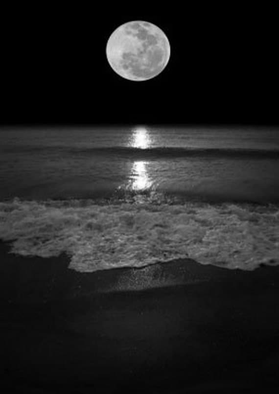 Romantic Sunset Seascape of A Full Moon Sunset And Sea. Black