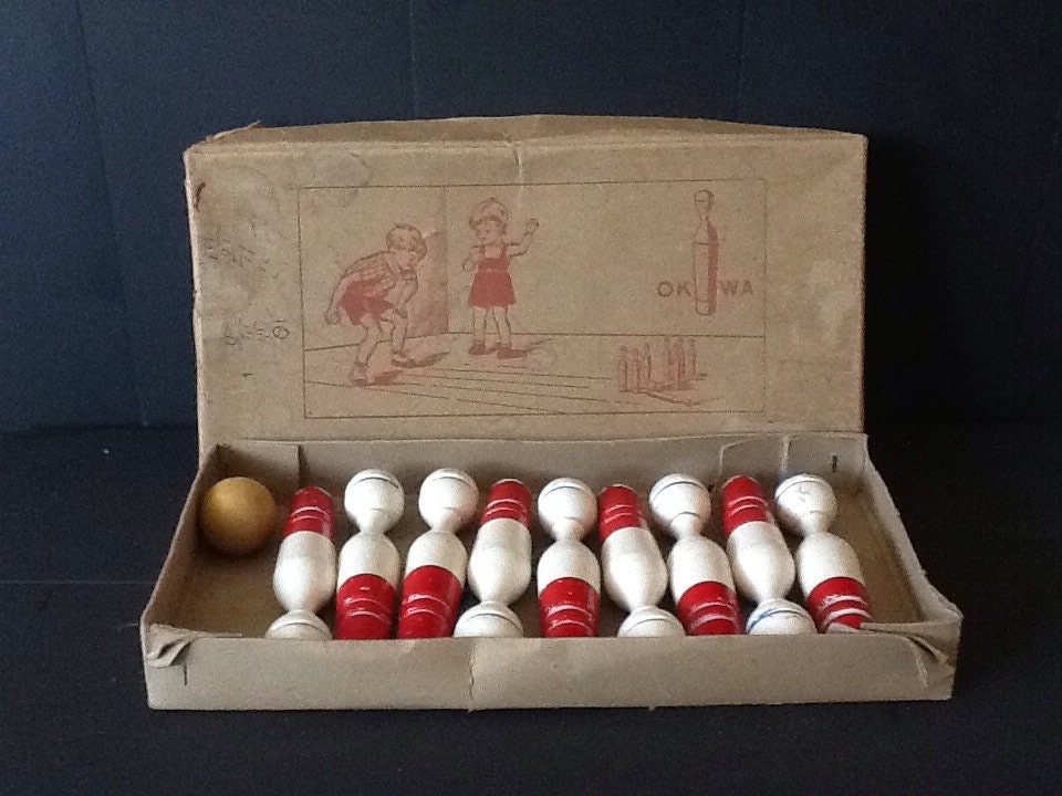 Vintage nine pins bowling game in original box made by Okwa.