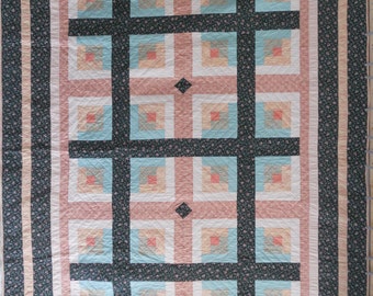 King size quilt. Log cabin quilt. Green and peach. Hand quilted. 100% cotton. Finished size 100" x 114". Queen or king size bed.