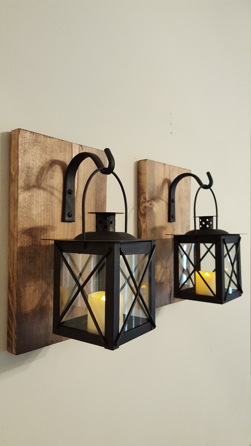 Lantern Pair with wrought iron hooks rustic wood boards